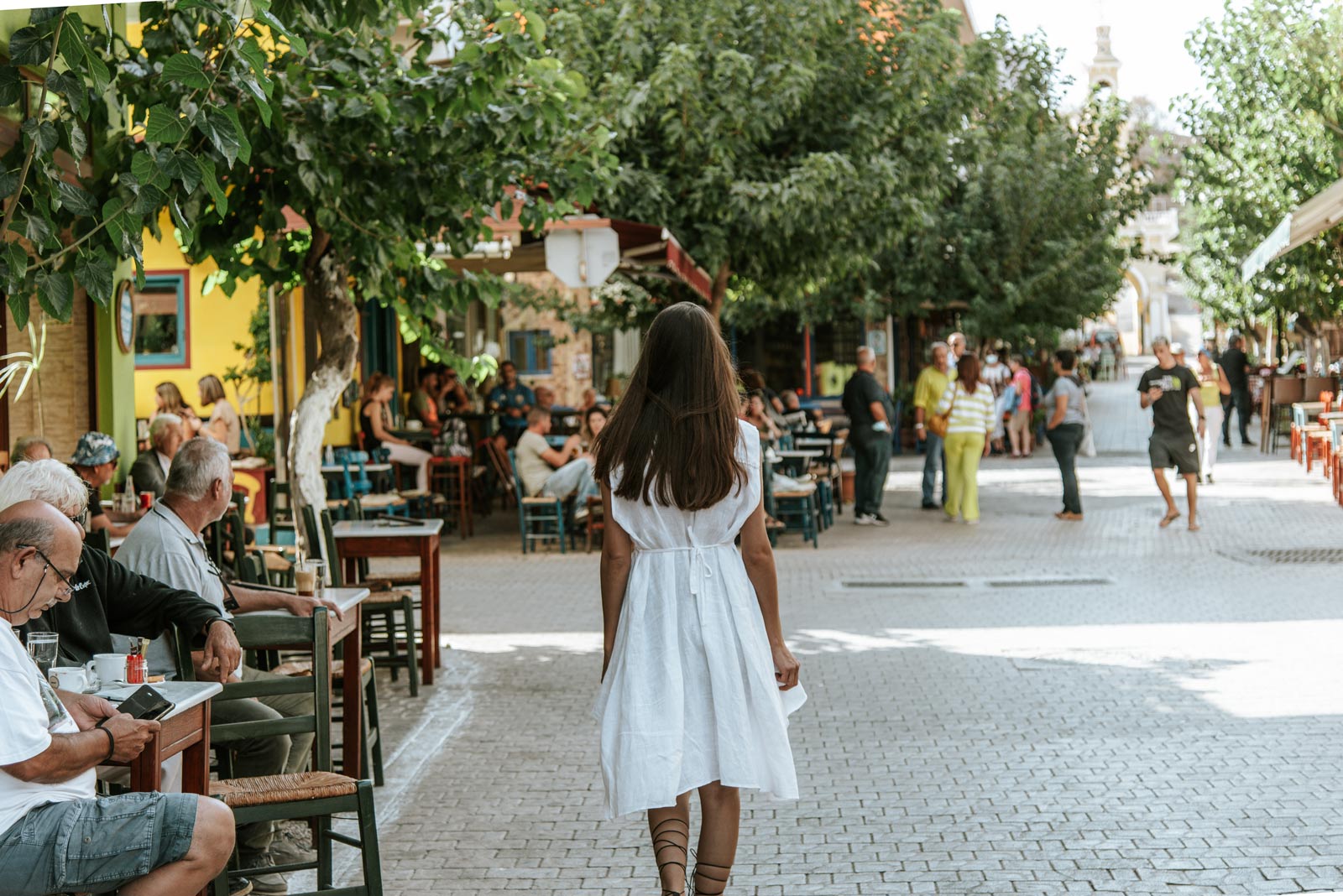 Woman walking at Palaiochoras pedestrian area