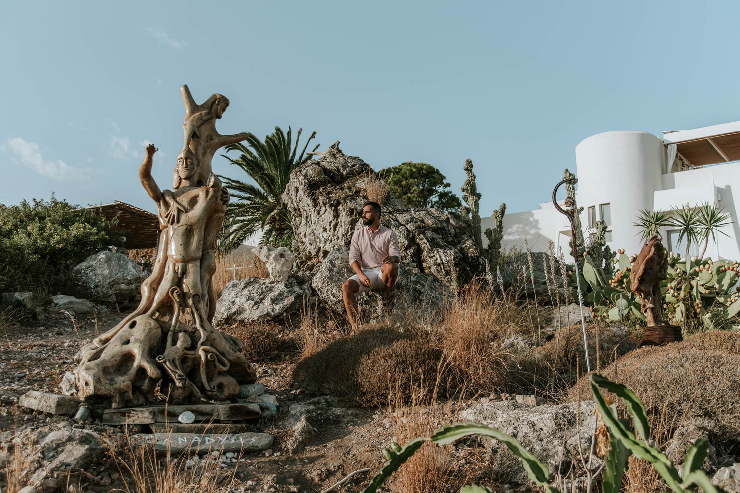 Man posing at hotel's garden