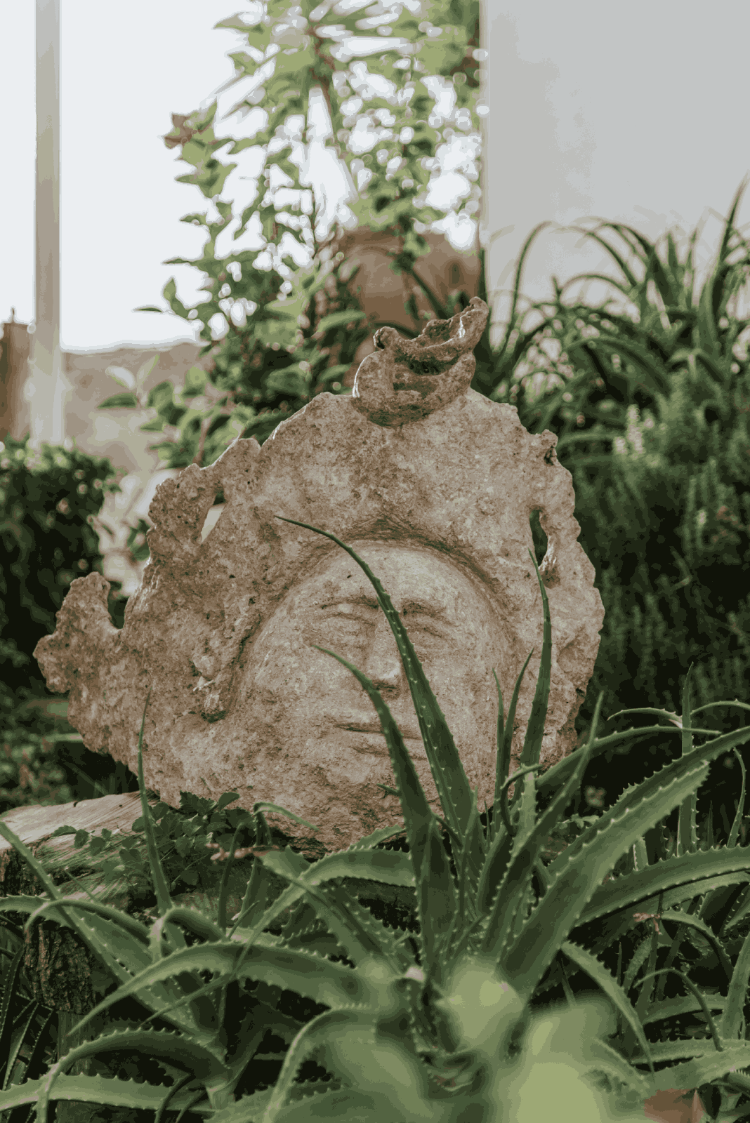 Stone mask at hotel's garden