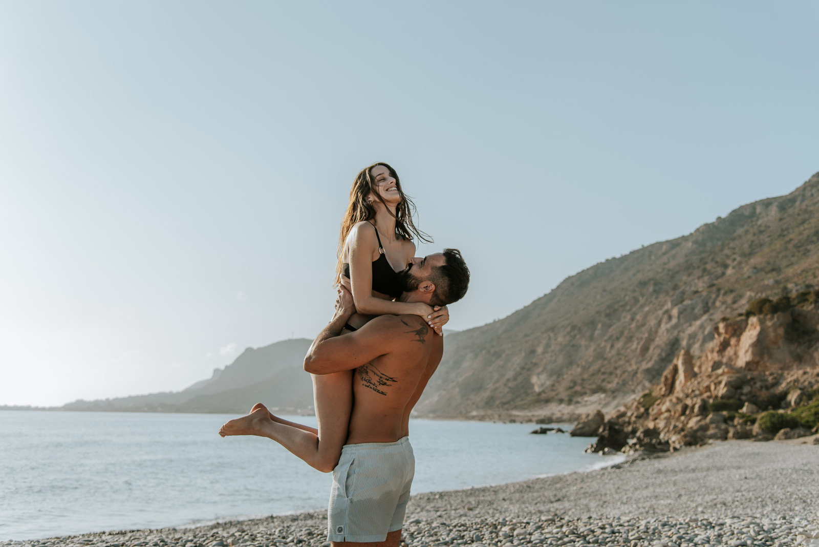 Couple hugging at the beach