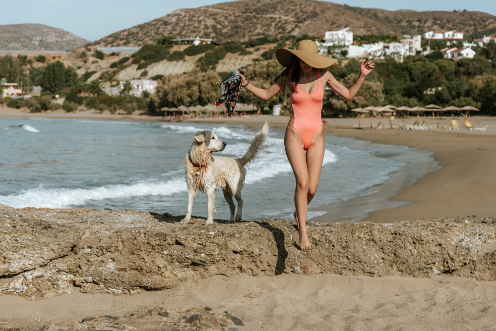 Woman with her dog at the beach
